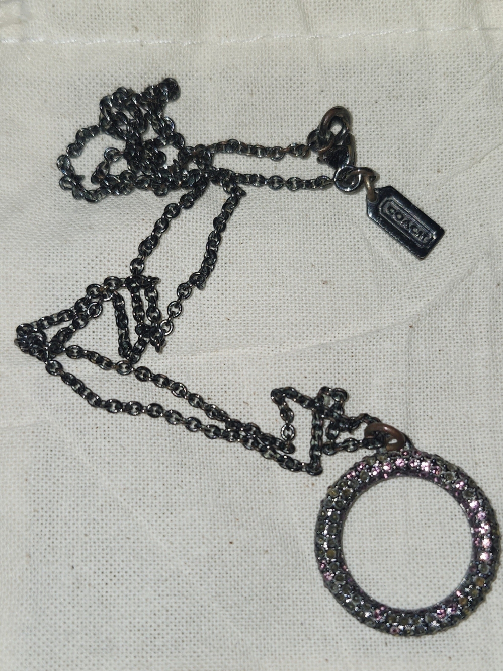 Coach Black-Tone Open Circle Pendant Necklace with Pink Crystals